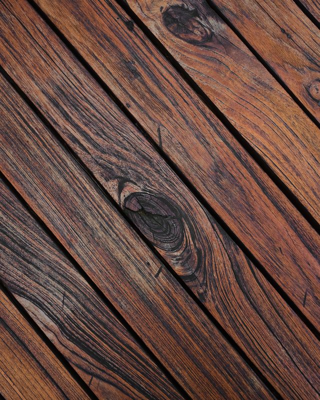 Close-up of deep, even stain finish on deck boards